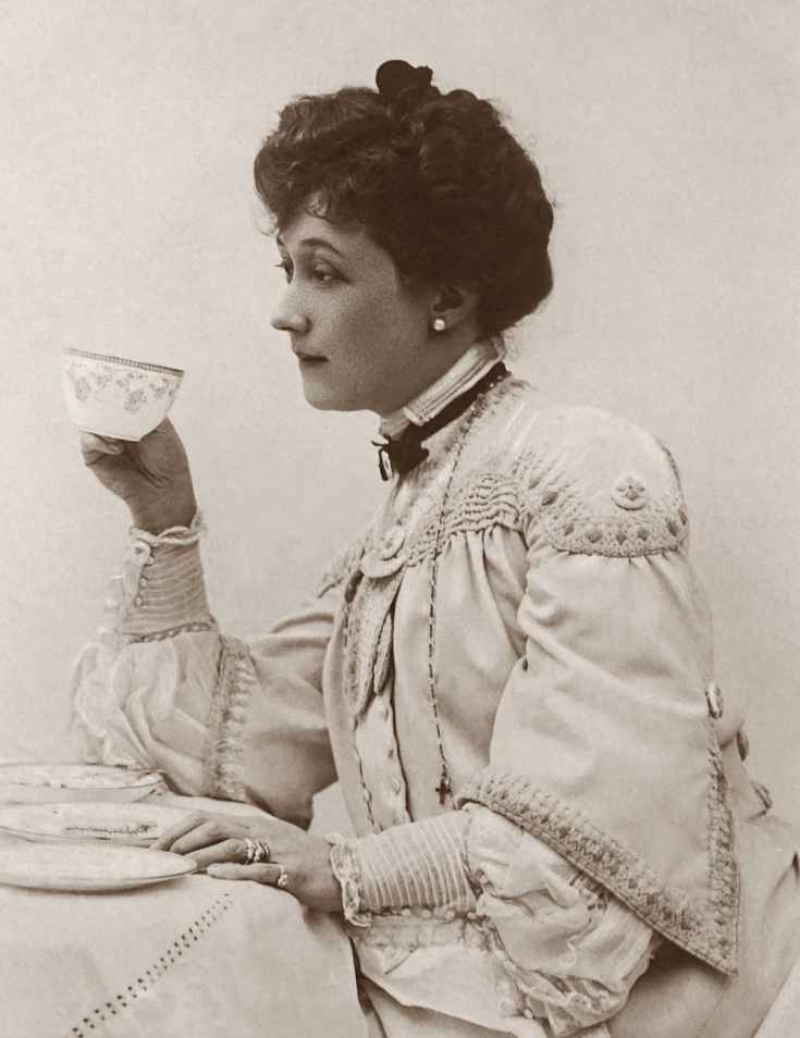 classic photo of a woman holding a tea cup